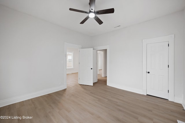 unfurnished bedroom featuring light hardwood / wood-style flooring and ceiling fan