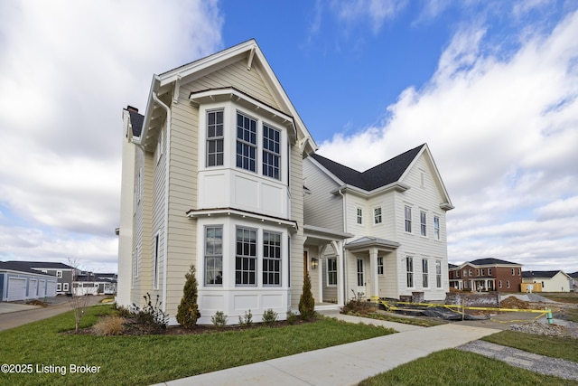 view of front of property with a front lawn