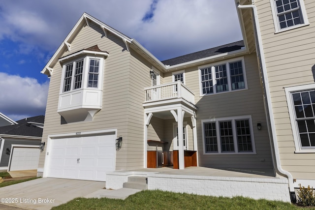 view of front of property with a balcony and a garage