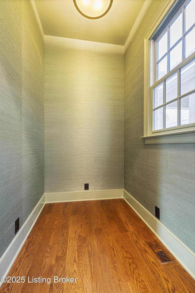 unfurnished room with wood-type flooring