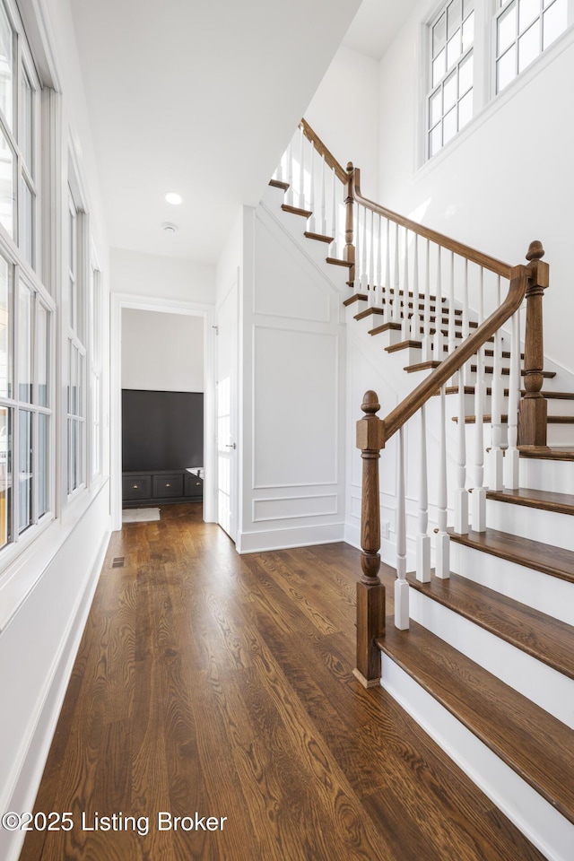 stairway featuring hardwood / wood-style floors