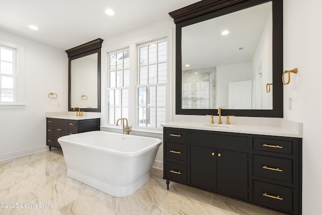 bathroom featuring plenty of natural light, plus walk in shower, and vanity