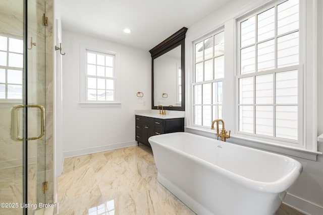 bathroom with separate shower and tub and vanity