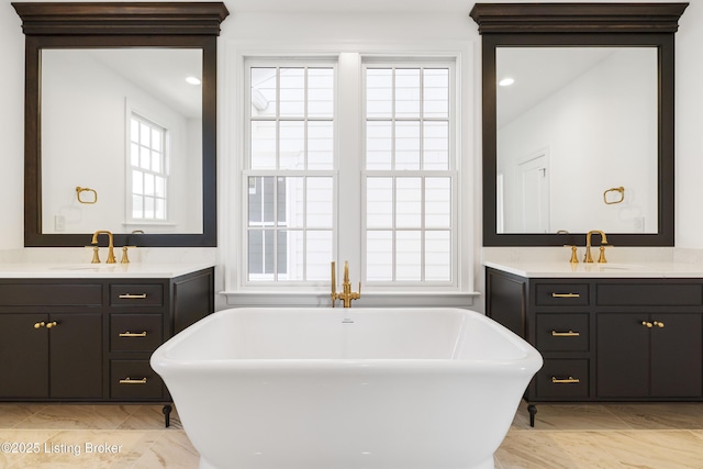 bathroom with a bath and vanity