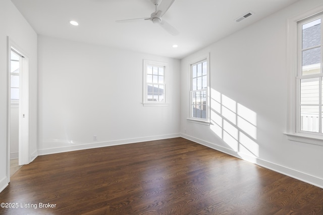 unfurnished room featuring dark hardwood / wood-style floors and ceiling fan