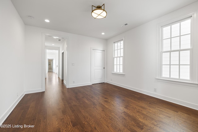 unfurnished room featuring dark hardwood / wood-style floors