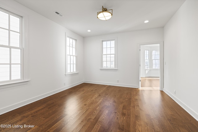 empty room featuring dark hardwood / wood-style floors