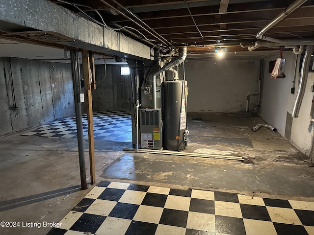 basement featuring gas water heater and heating unit