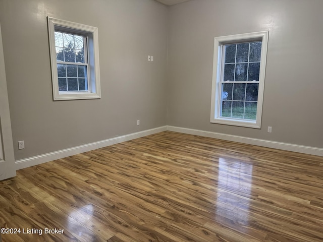 empty room featuring hardwood / wood-style flooring