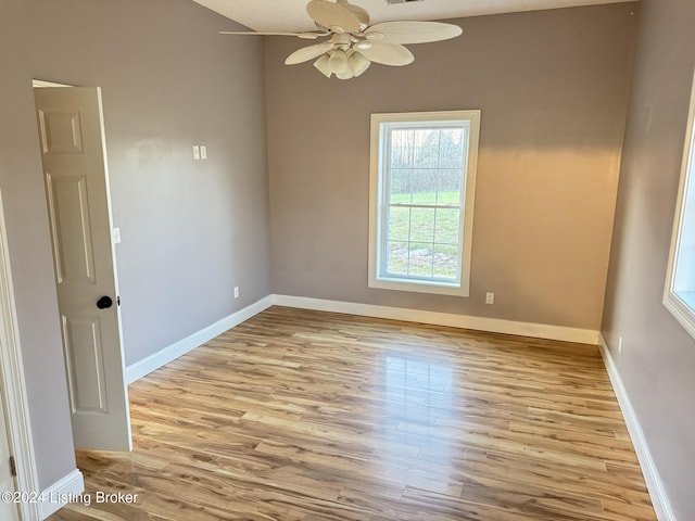 unfurnished room featuring light hardwood / wood-style floors and ceiling fan