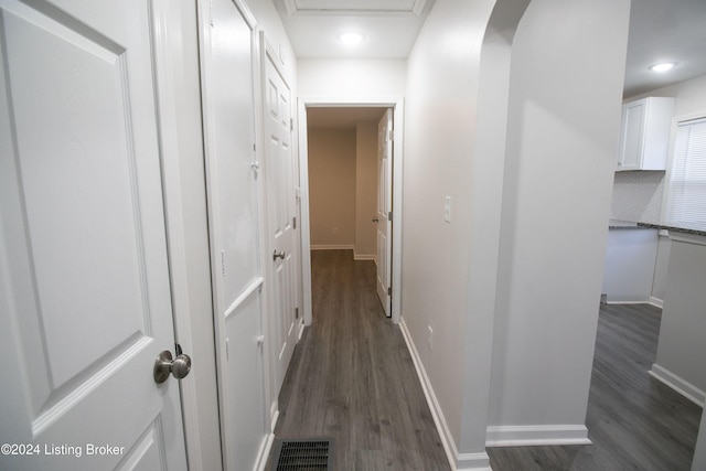 corridor featuring dark wood-type flooring