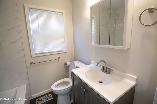 bathroom with vanity and toilet