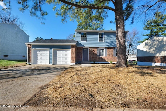 front facade with a garage and a front lawn