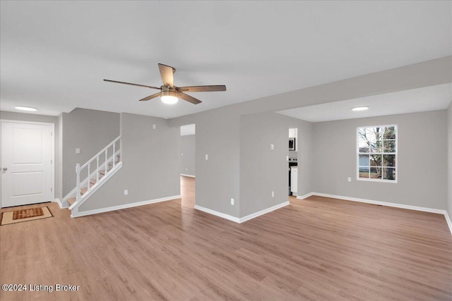 interior space with ceiling fan and light hardwood / wood-style floors