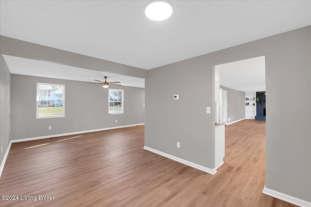 spare room with light hardwood / wood-style floors and ceiling fan