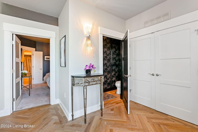 hallway featuring light parquet floors