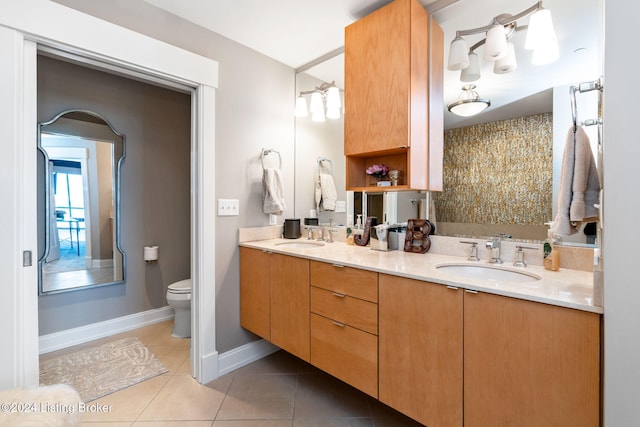 bathroom featuring tile patterned floors, vanity, and toilet