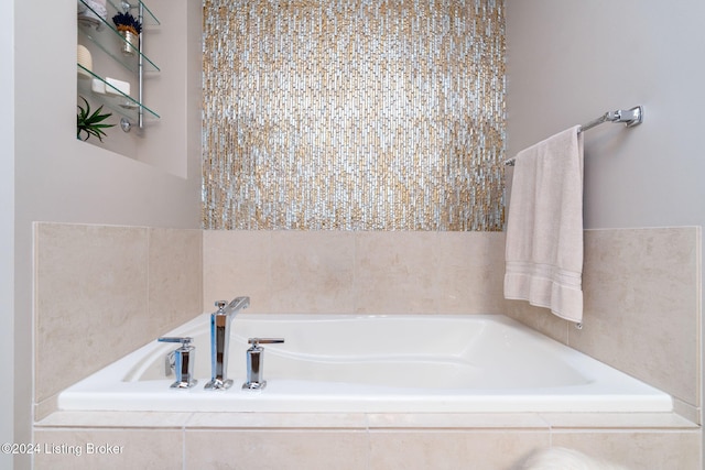 bathroom with tiled bath