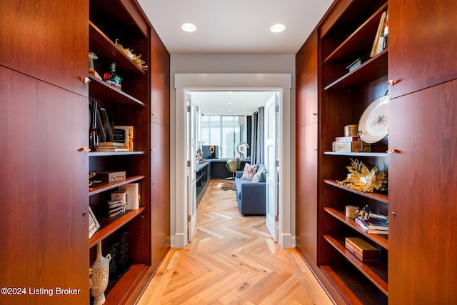 corridor with light parquet flooring