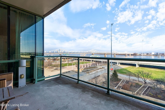 balcony featuring a water view