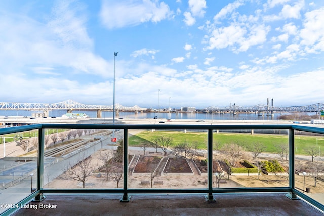 balcony featuring a water view