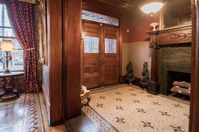 entrance foyer featuring crown molding