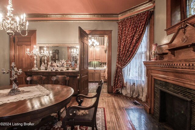 dining room featuring hardwood / wood-style flooring and ornamental molding