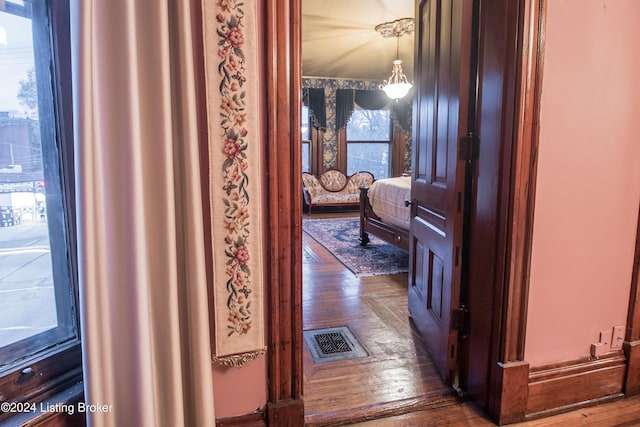 corridor featuring dark hardwood / wood-style floors