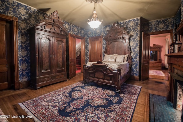 bedroom with dark wood-type flooring