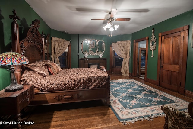 bedroom with hardwood / wood-style floors and ceiling fan