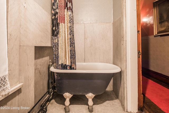 bathroom featuring a washtub