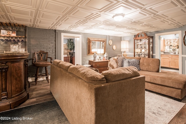 living room featuring dark hardwood / wood-style flooring and bar