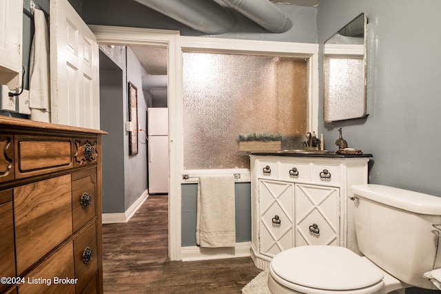 bathroom with sink, hardwood / wood-style floors, and toilet