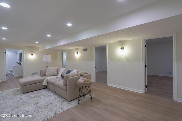 9415 Rockycreek Ln, Louisville, KY 40299 - living area featuring recessed lighting, visible vents, baseboards, and wood finished floors