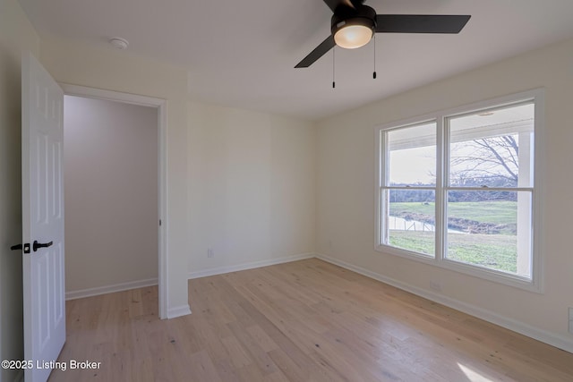 9415 Rockycreek Ln, Louisville, KY 40299 - empty room featuring a ceiling fan, light wood-type flooring, and baseboards