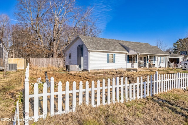 view of front of property with a porch and cooling unit