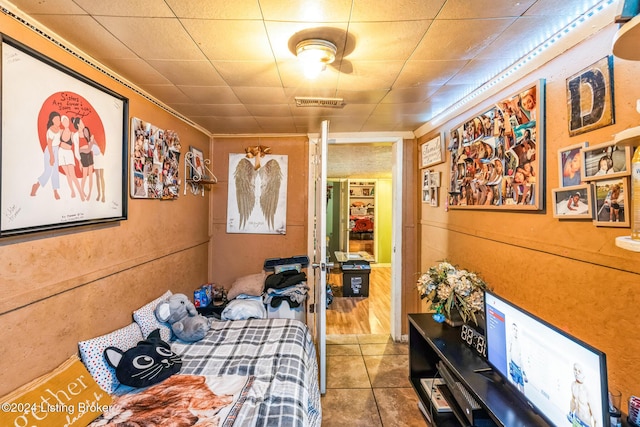 bedroom with tile patterned floors and ceiling fan