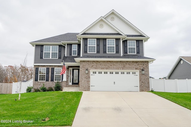 view of front of property with a garage and a front lawn