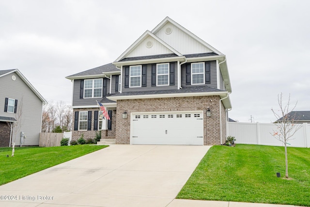 view of front of property with a garage and a front yard