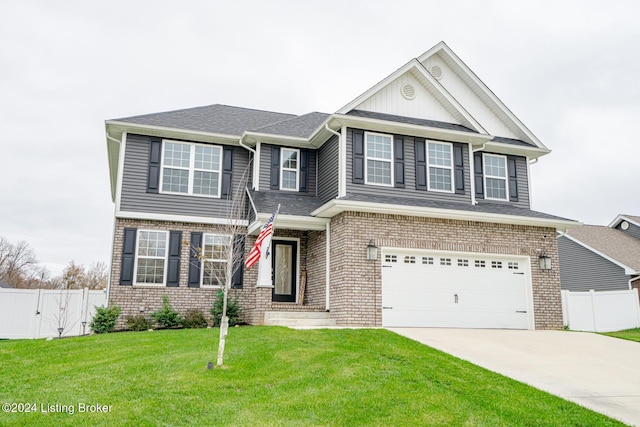 view of front facade with a front yard and a garage