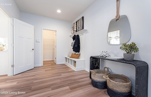 mudroom with light hardwood / wood-style floors