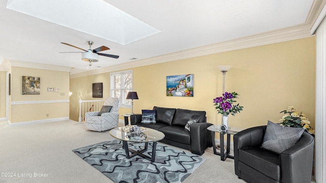 living room featuring a skylight, light carpet, crown molding, and ceiling fan