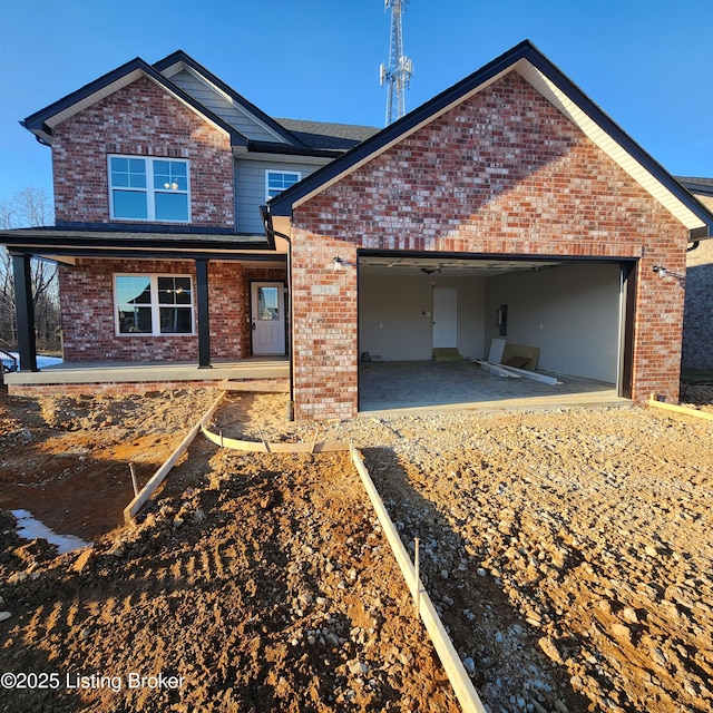 view of front of home featuring a garage and a porch