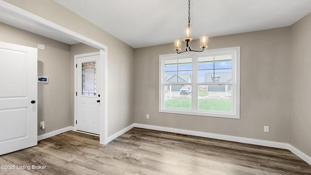 389 Williamsburg Dr, Mt Washington, KY 40047 - unfurnished dining area with baseboards, visible vents, wood finished floors, and a chandelier