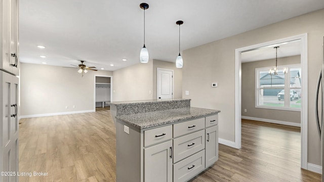 389 Williamsburg Dr, Mt Washington, KY 40047 - kitchen with a center island, light wood-type flooring, baseboards, ceiling fan with notable chandelier, and recessed lighting