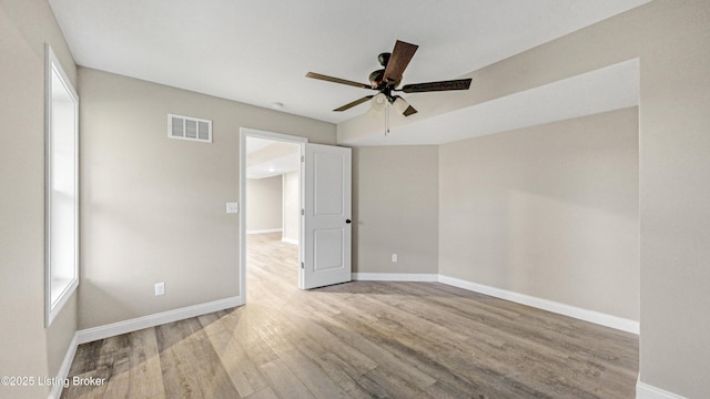 389 Williamsburg Dr, Mt Washington, KY 40047 - unfurnished room with baseboards, visible vents, wood finished floors, and a ceiling fan