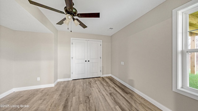 389 Williamsburg Dr, Mt Washington, KY 40047 - unfurnished bedroom with baseboards, visible vents, a closet, and wood finished floors
