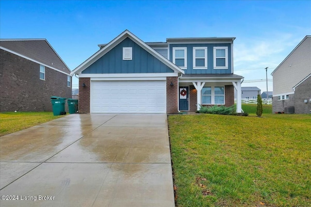 view of front of home featuring cooling unit, a garage, and a front lawn