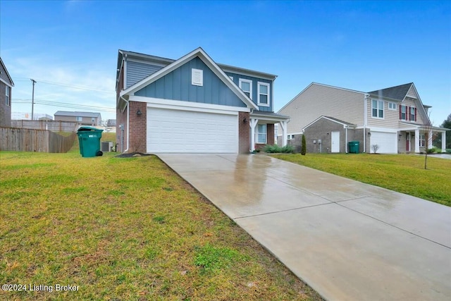 view of front of house featuring a front yard and a garage