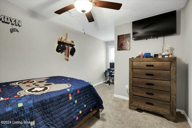 bedroom with light carpet and ceiling fan